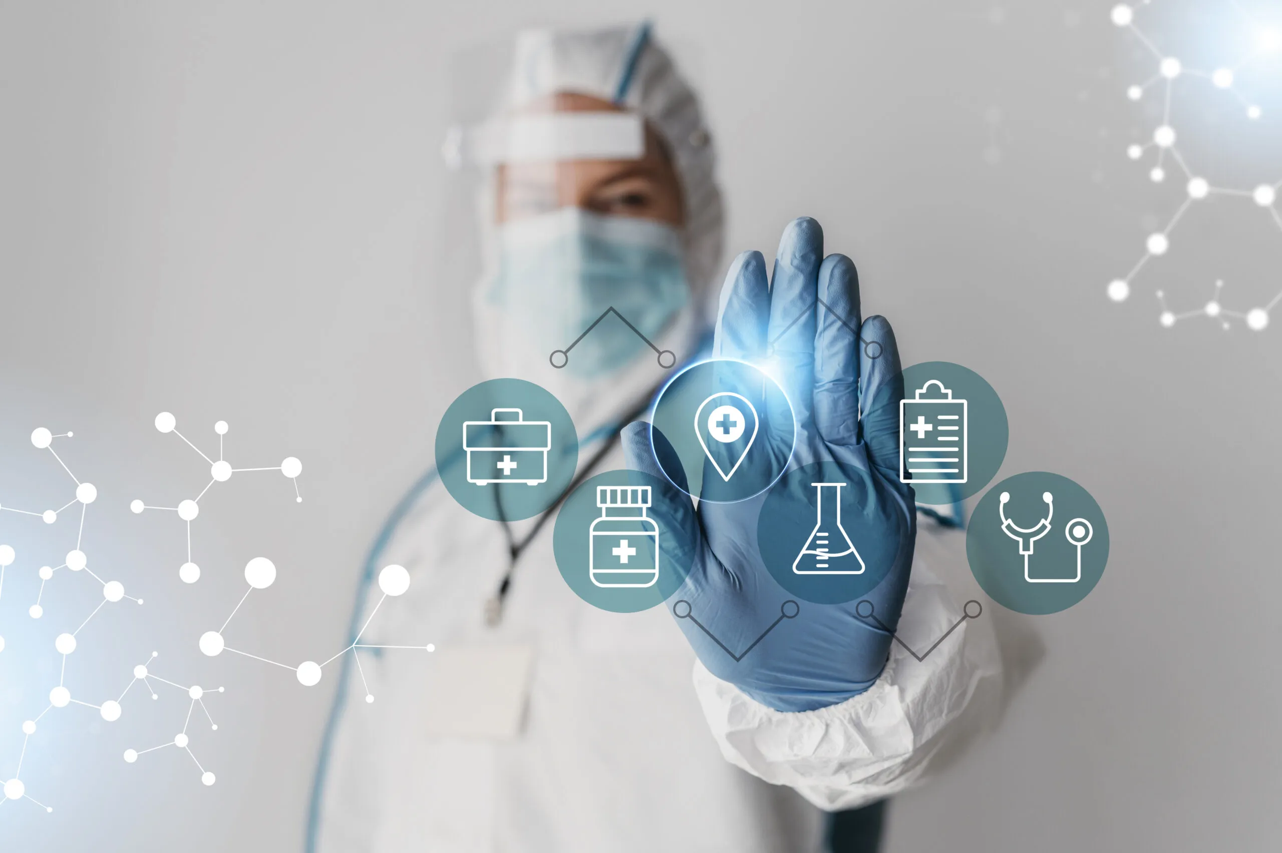 A healthcare worker in protective gear gesturing with a hand, with medical icons around them.