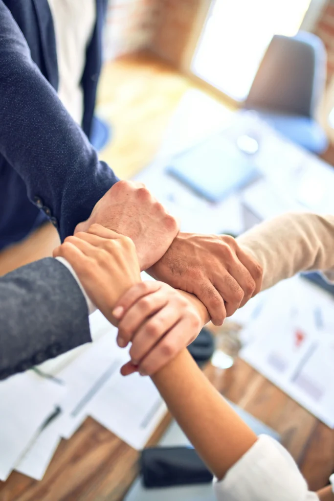 partners gripping hand of each other