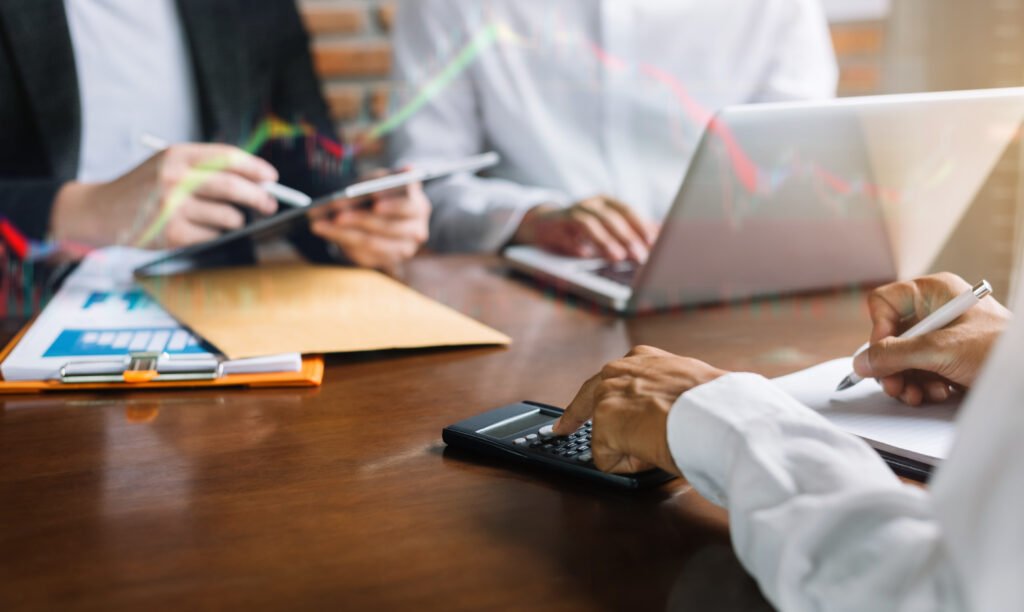 Close up Businessman and partner calculating finance